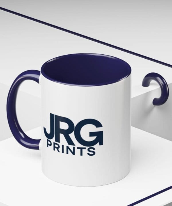 Custom coffee mug at an angle showing navy interior and handle for branded drinkware