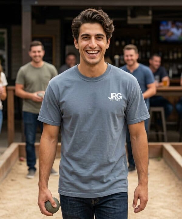 Custom garment-dyed t-shirt worn at a team event, showing relaxed fit