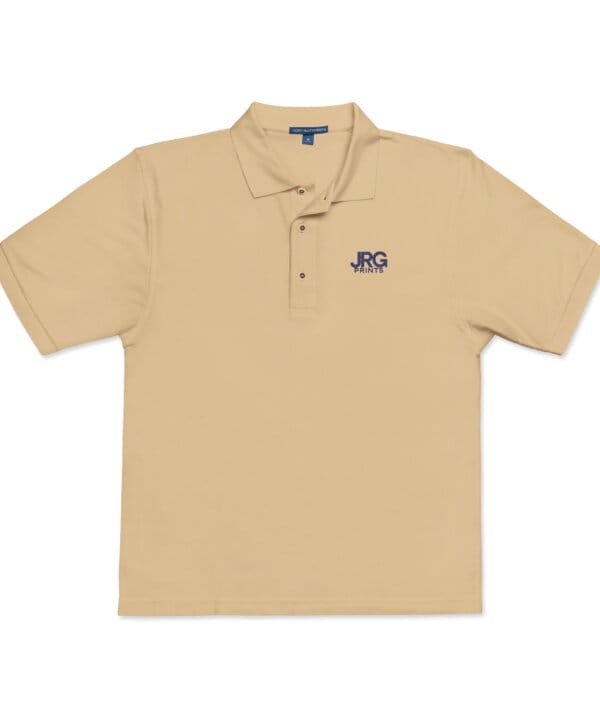 Custom stone corporate polo with the navy JRG Prints logo embroidered on the left chest