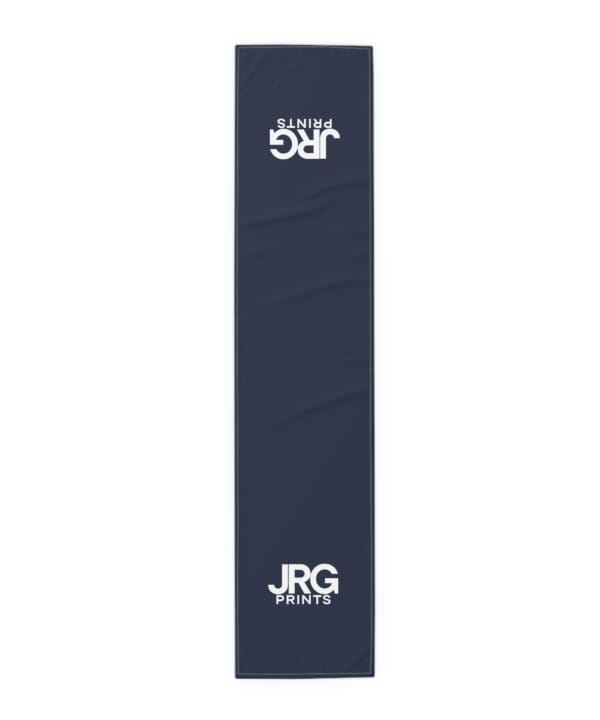 Navy custom table runner with the white JRG Prints logo at both ends