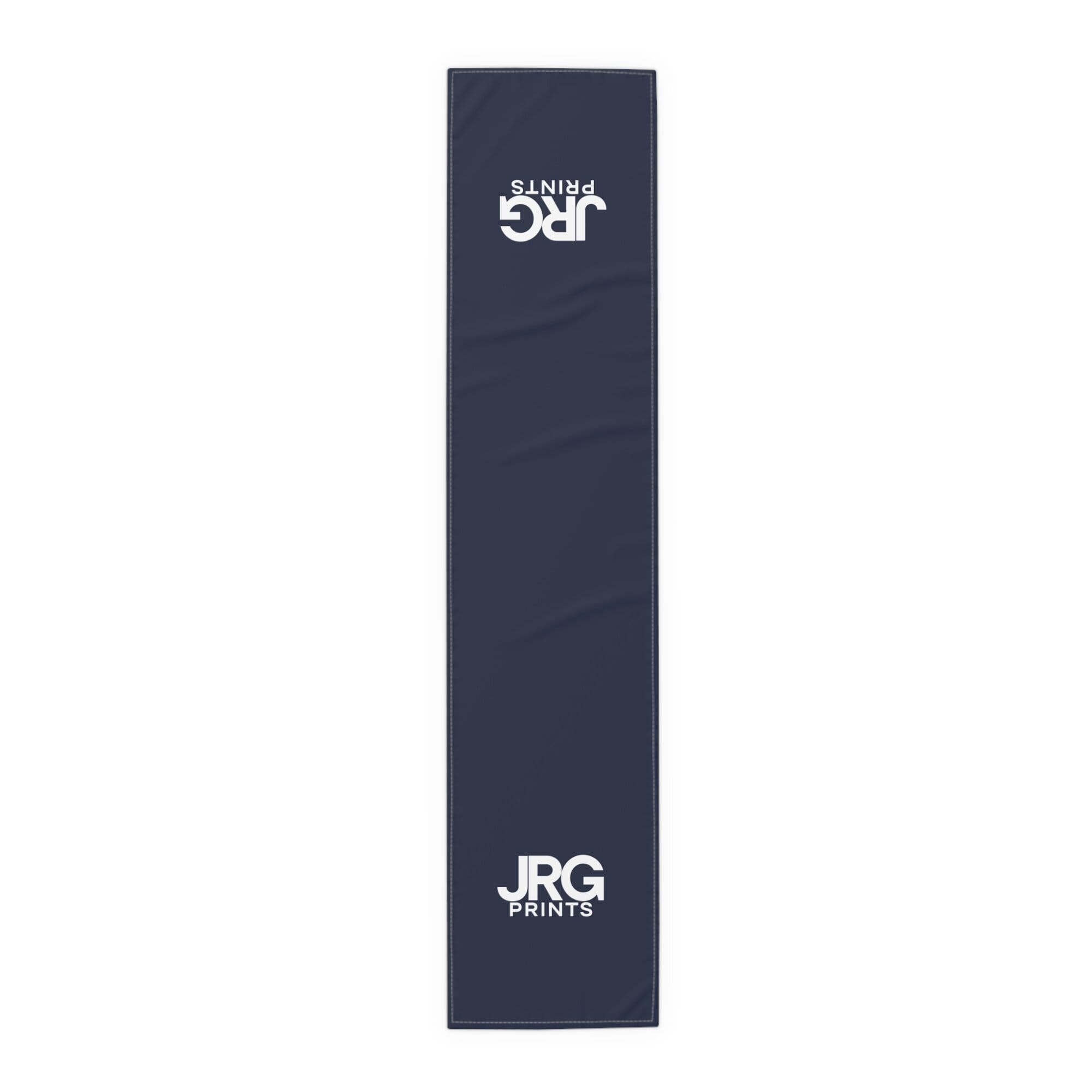 Navy custom table runner with the white JRG Prints logo at both ends