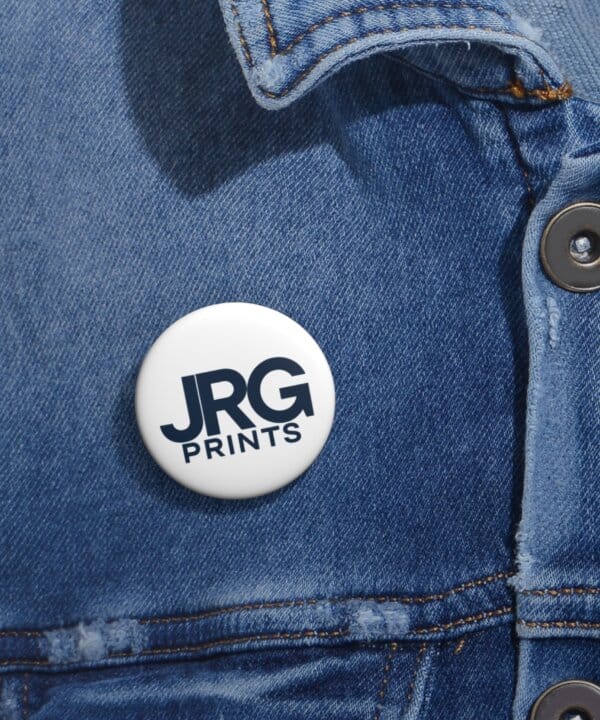 Custom logo pin buttons shown at an event