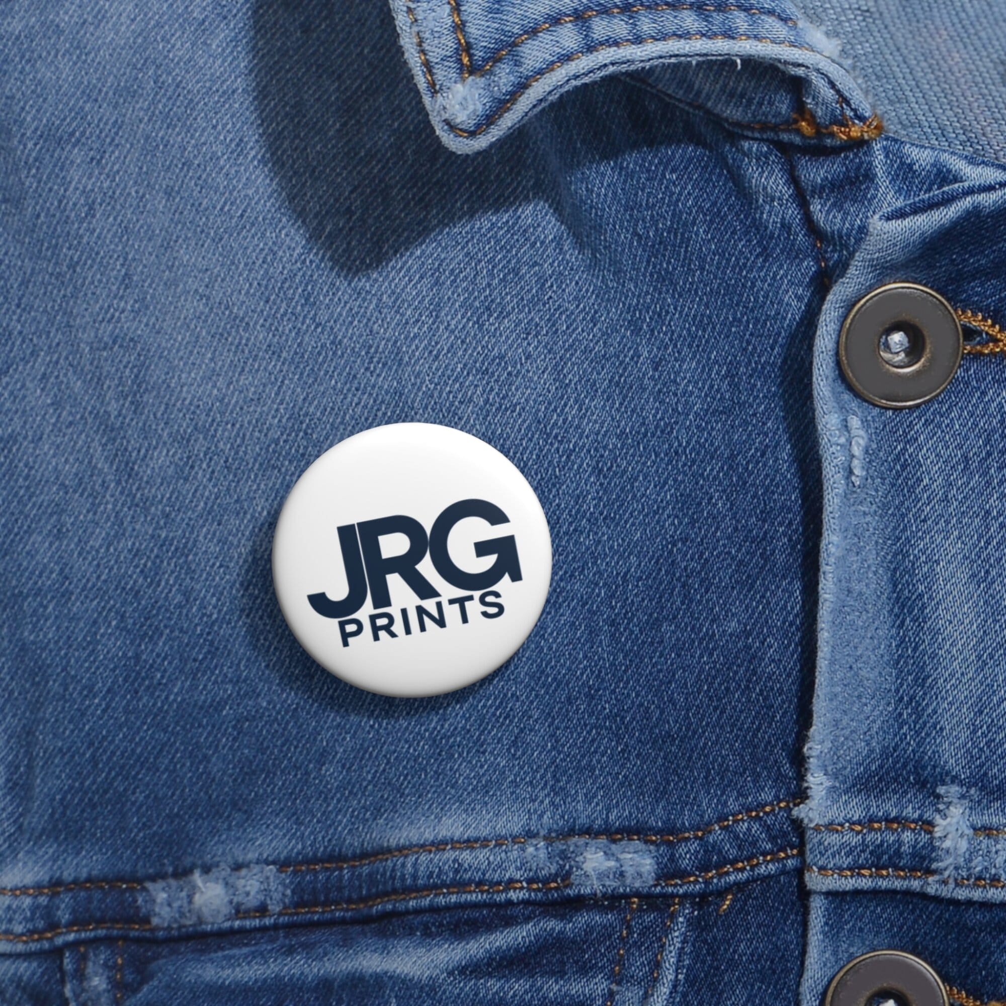 Custom logo pin buttons shown at an event
