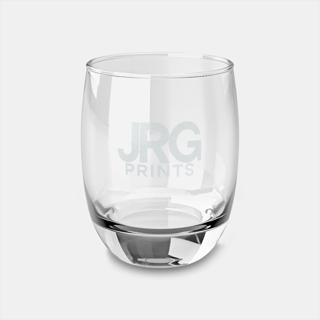 Laser-engraved rocks glass with a frosted JRG Prints logo etched into the surface